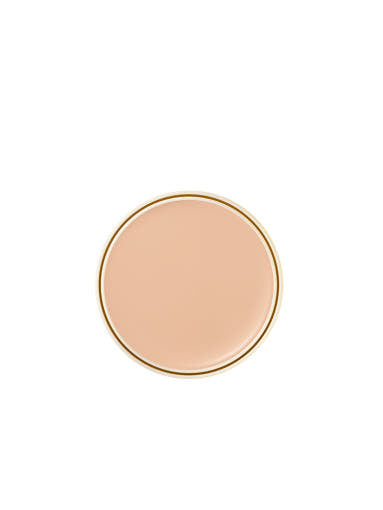 Round beige compact on a white background