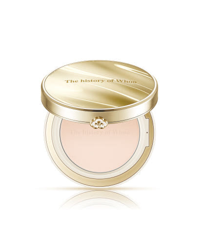 Cosmetic compact with gold lid and visible brand logo on a white background