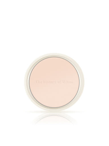 Compact powder in a round container on a white background